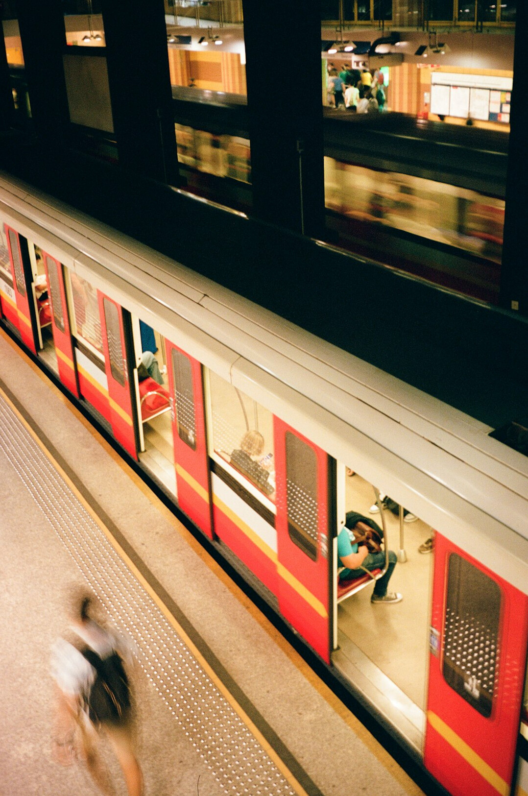 Travelers waiting at a Polish train station